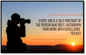 silhouette of a man taking a picture at sunset